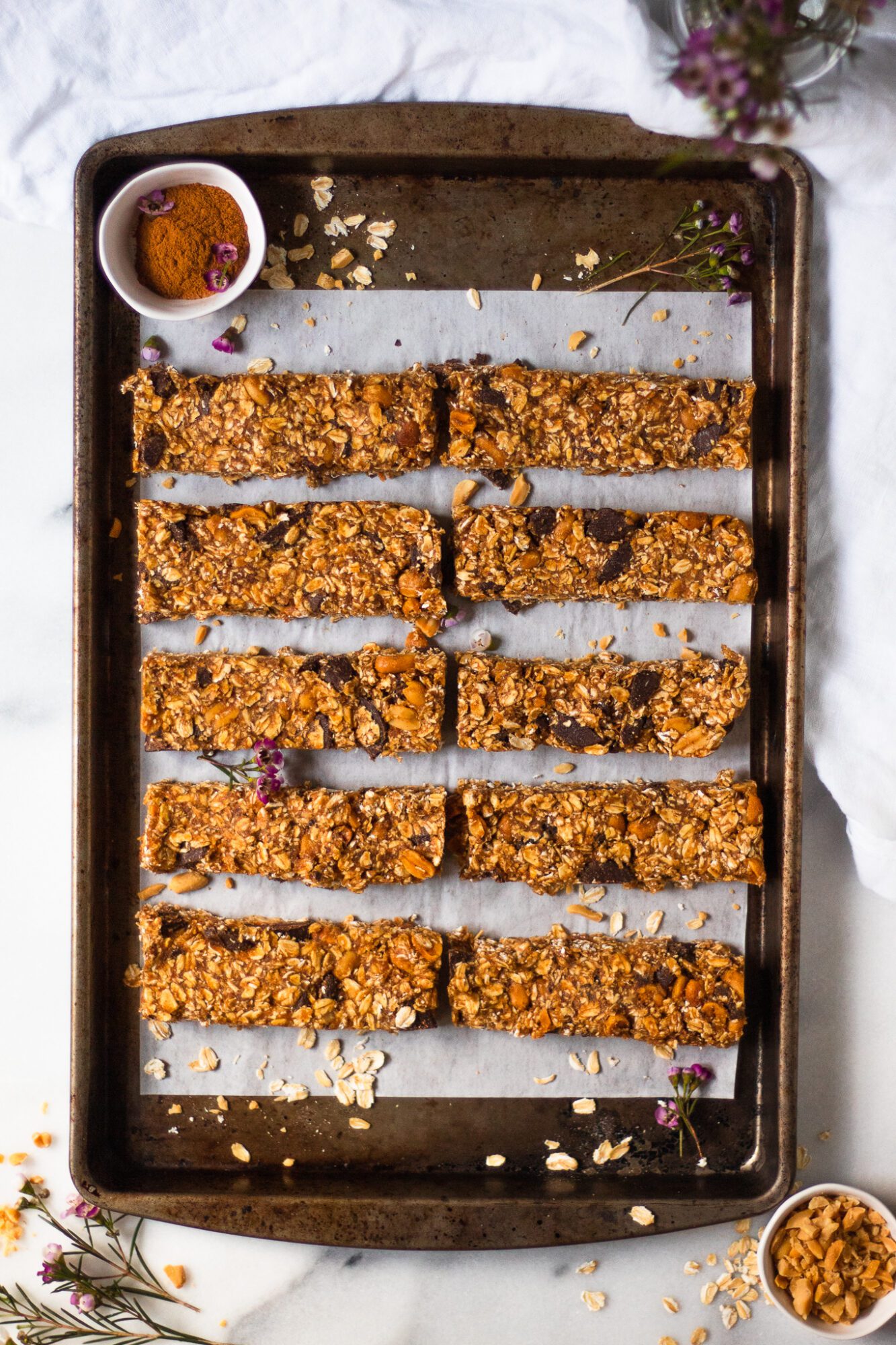 granola bars neatly arranged on baking sheet