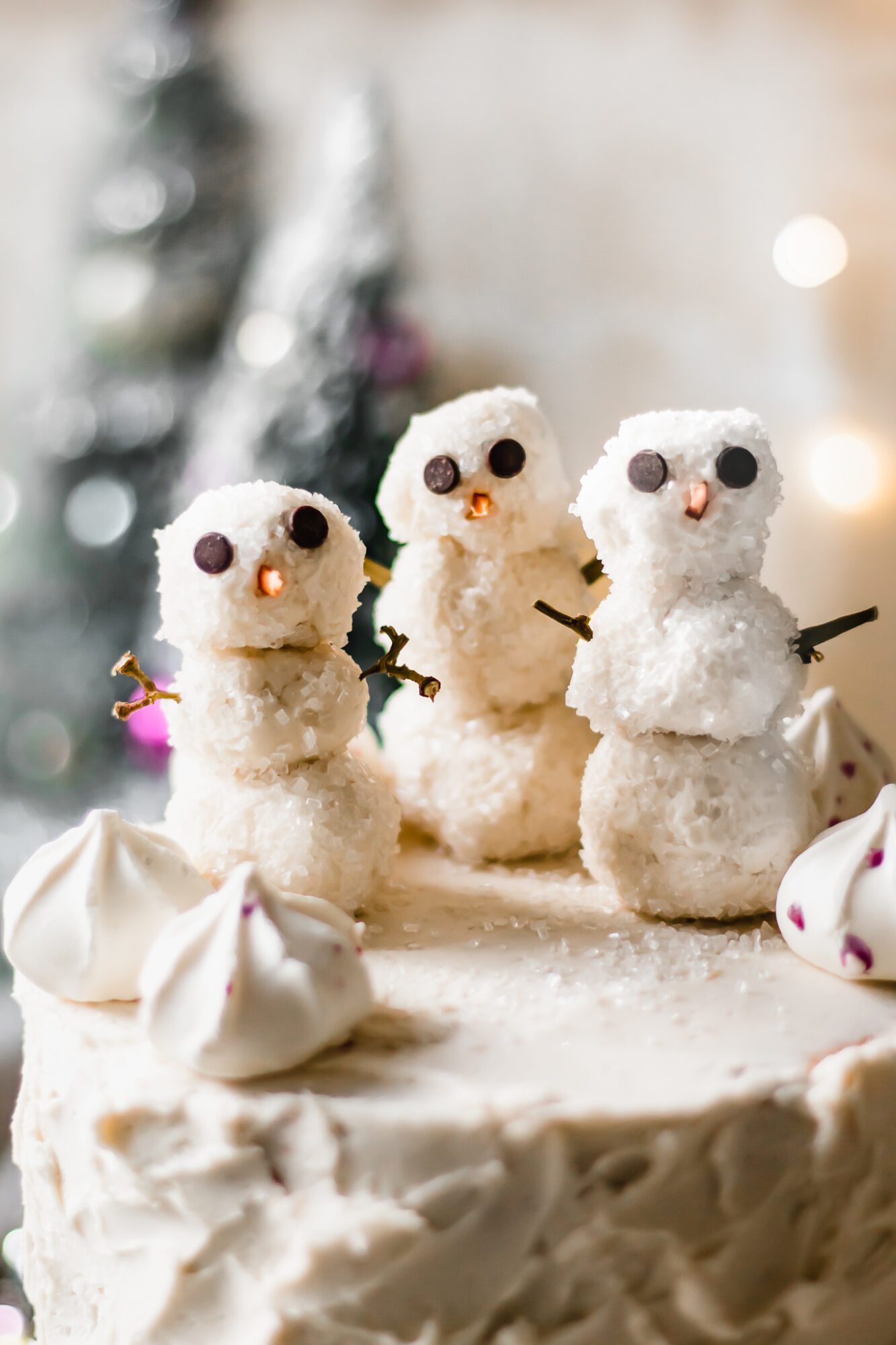 close up of buttercream frosting snowmen