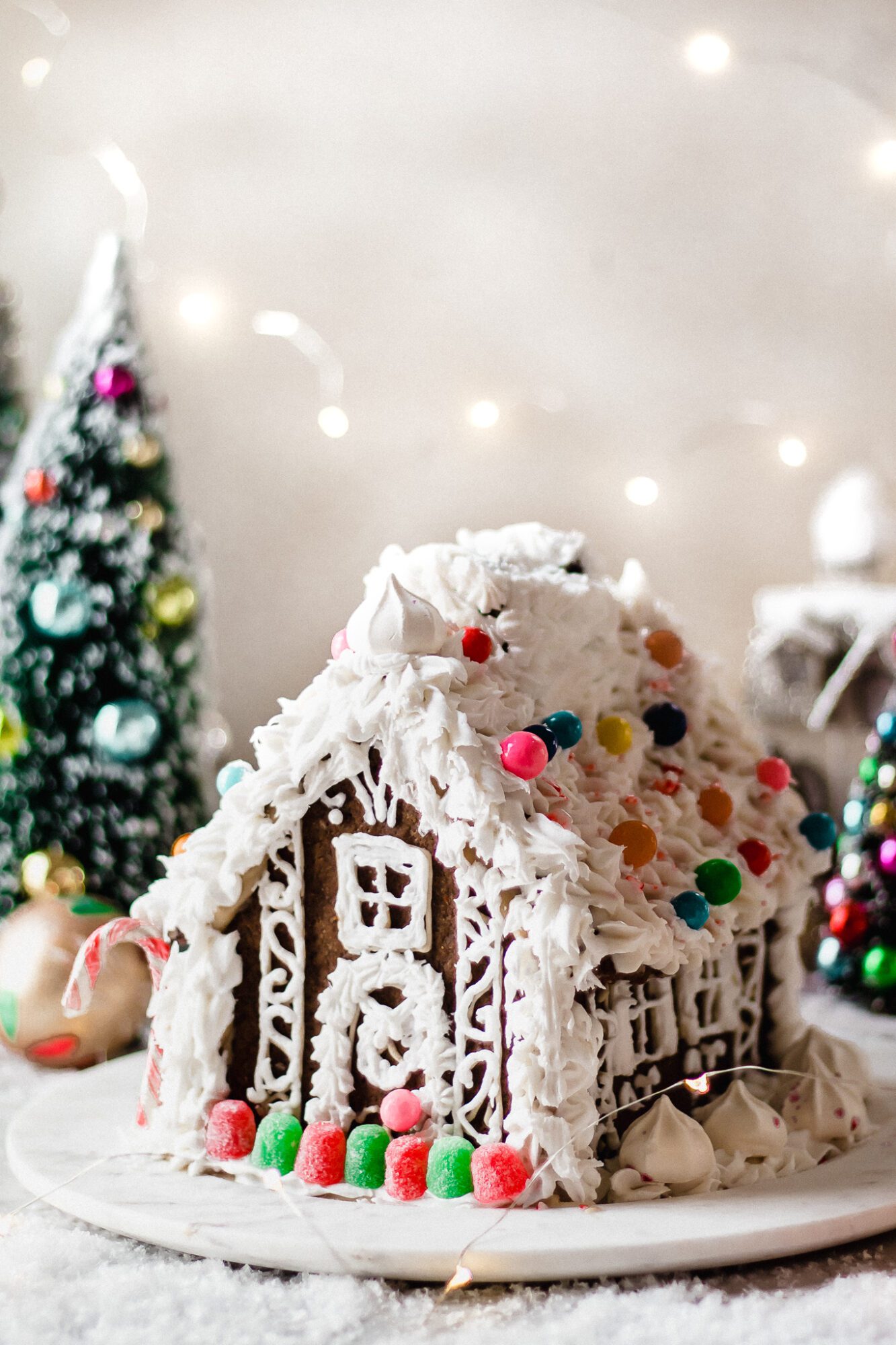 side of the gingerbread house on a marble plate
