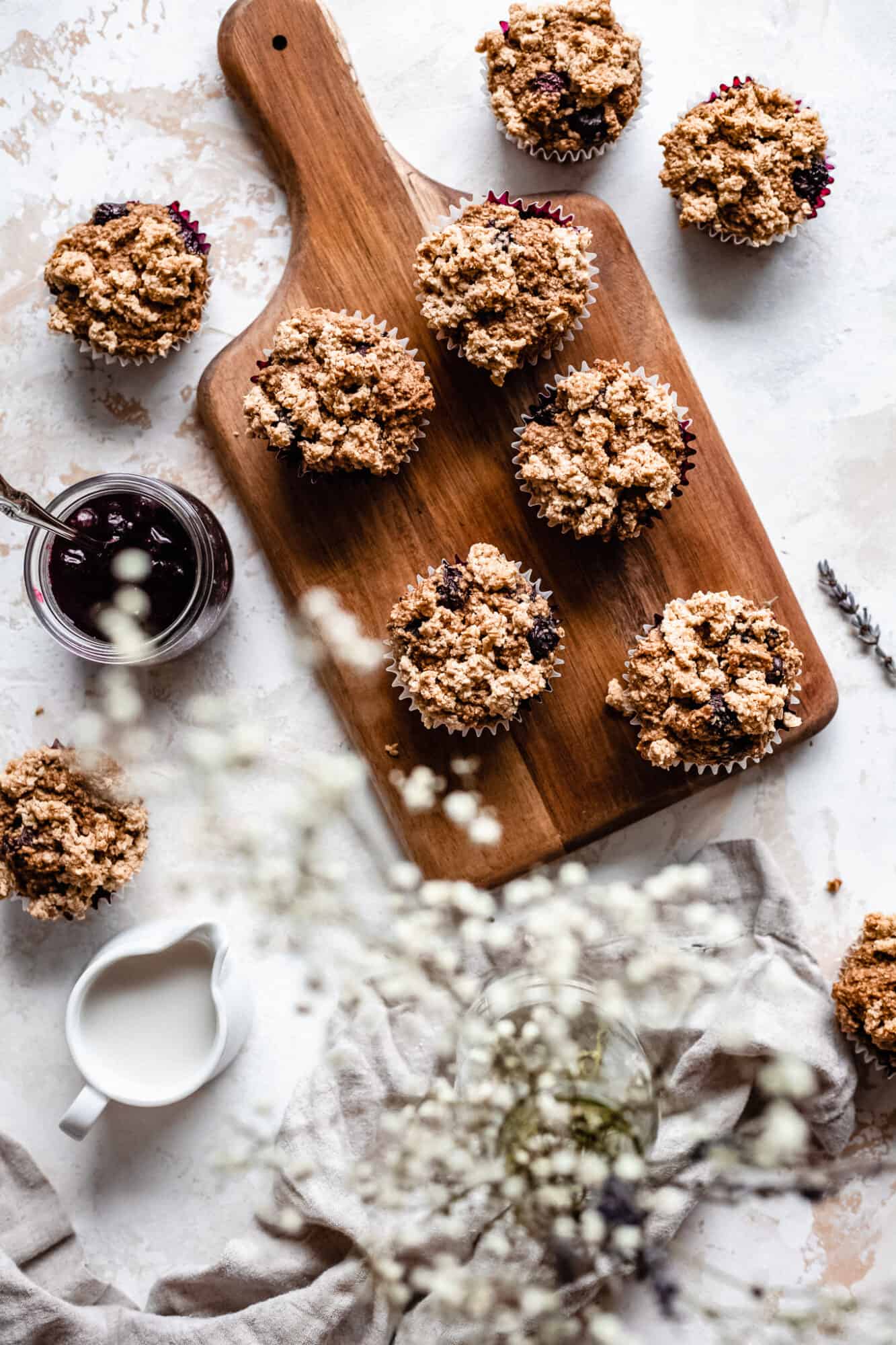 wooden board with gluten free vegan blueberry muffins