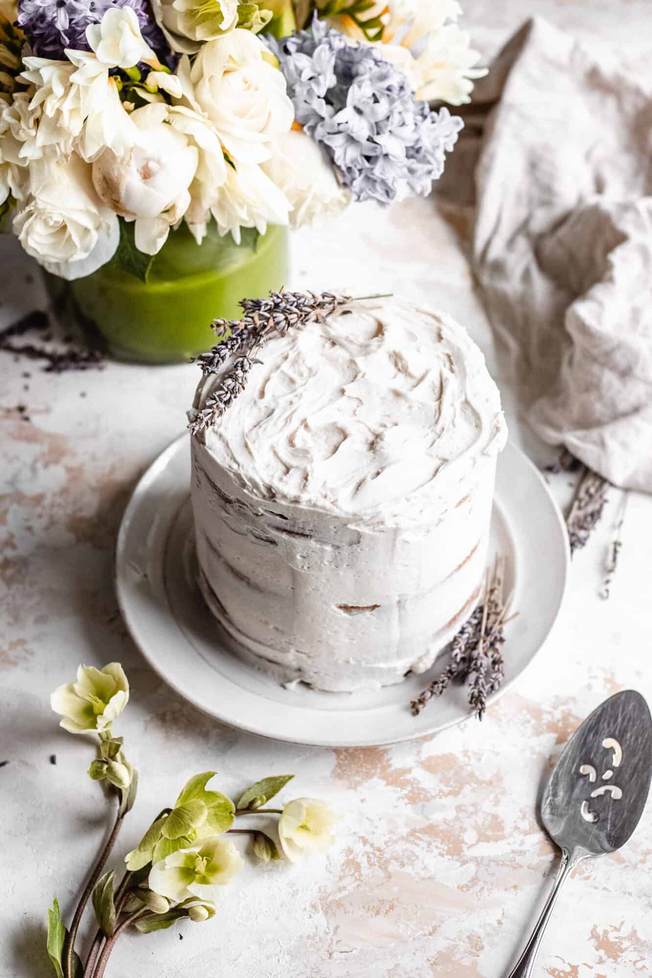whole vegan vanilla cake with lavender on top