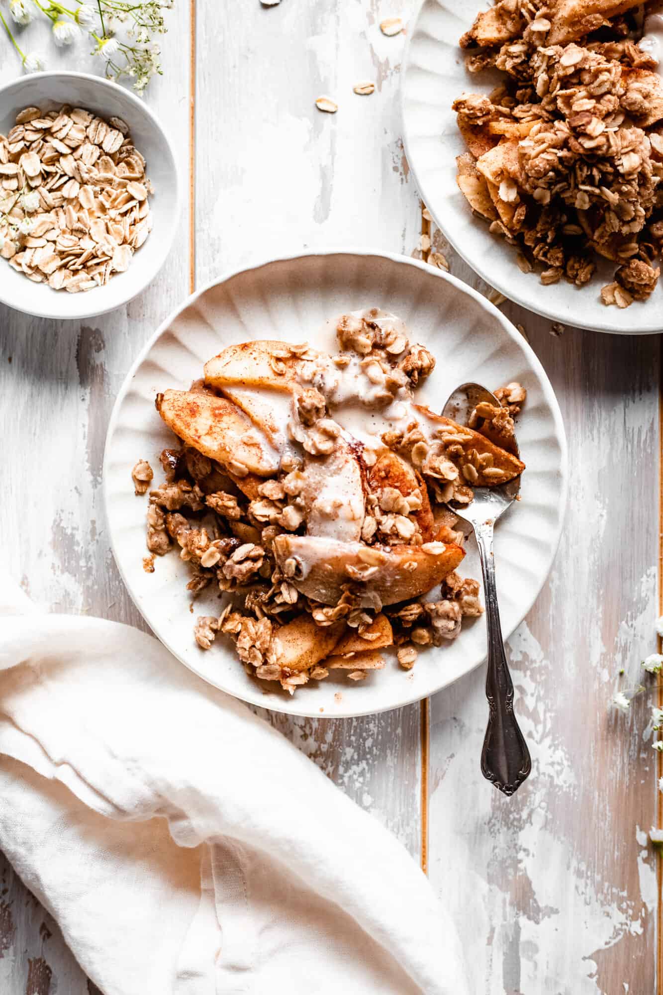 plate of vegan apple crisp with spoon