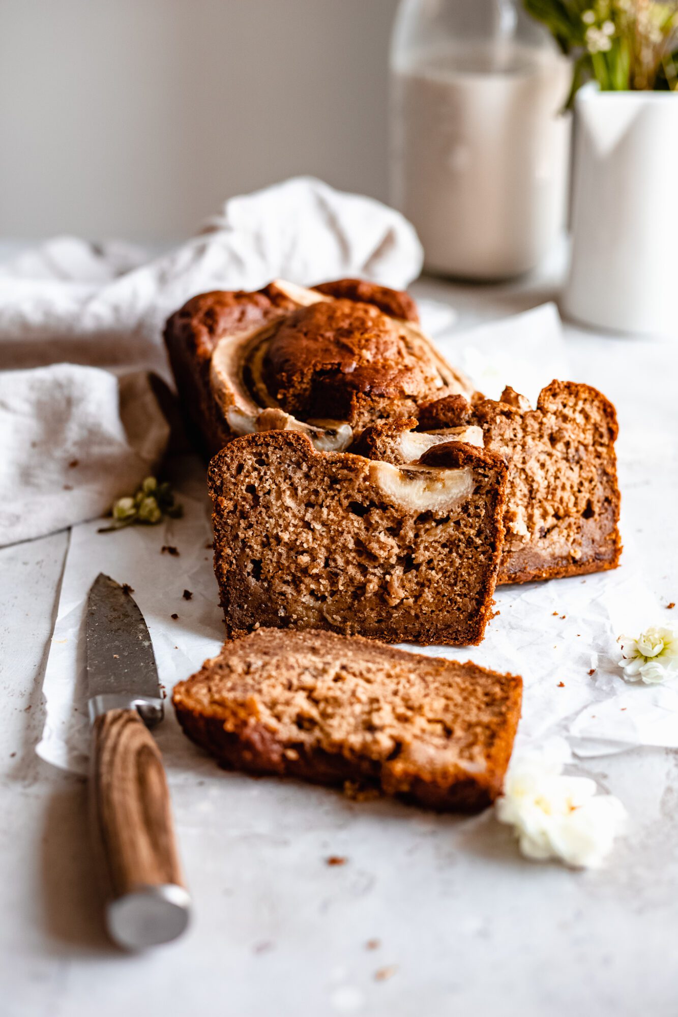 slices of banana bread leaning on loaf