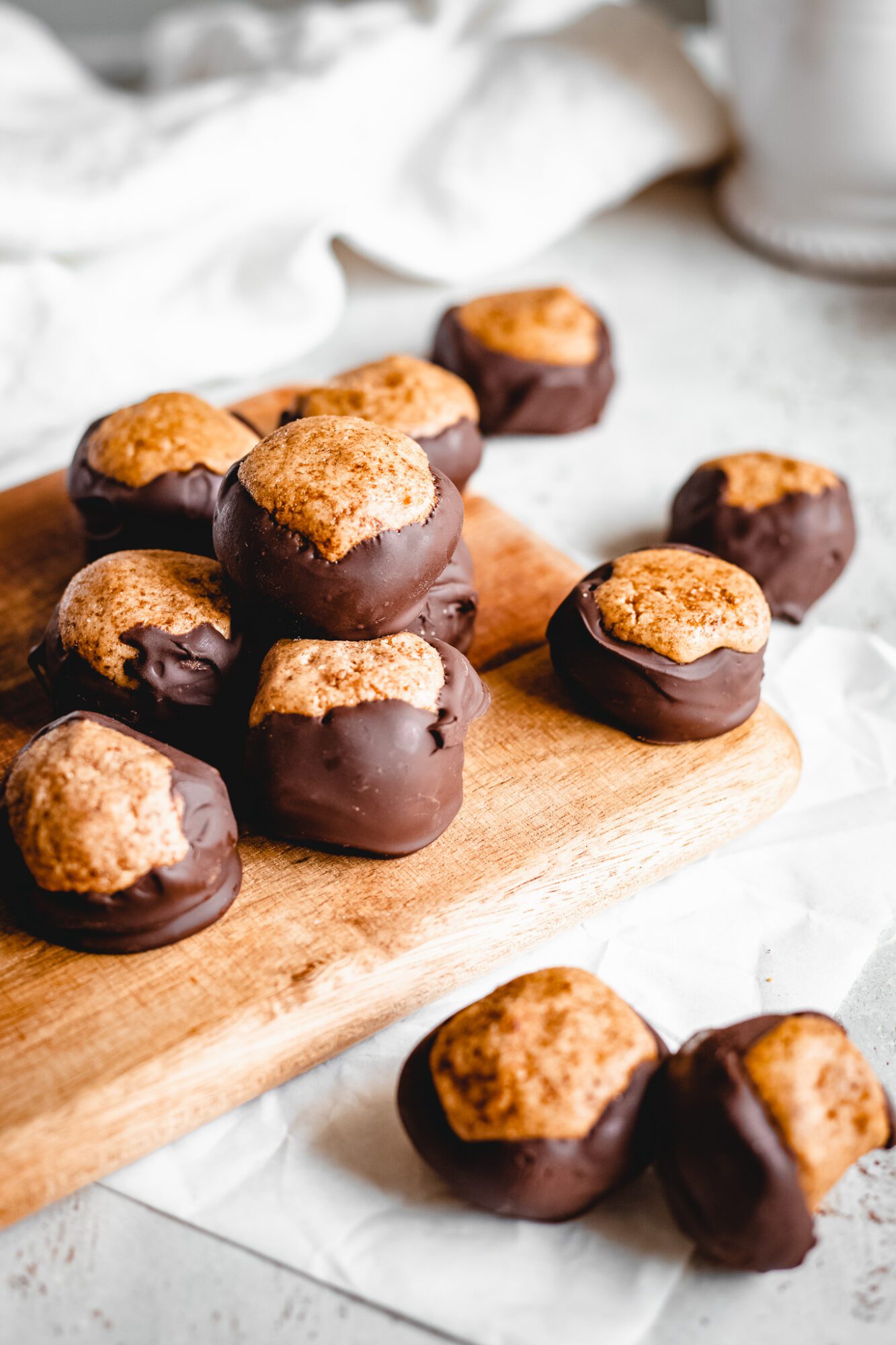peanut butter balls on wooden board