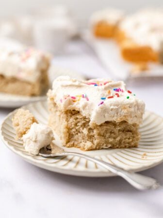 slice of vanilla sheet cake on a plate