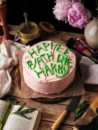 Harry Potter cake on a wooden table with books