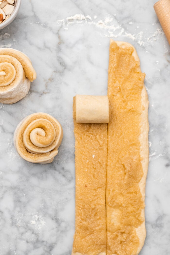 rolling the almond sweet rolls