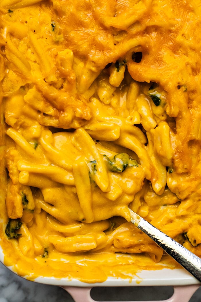 scooping out the butternut squash Mac and cheese