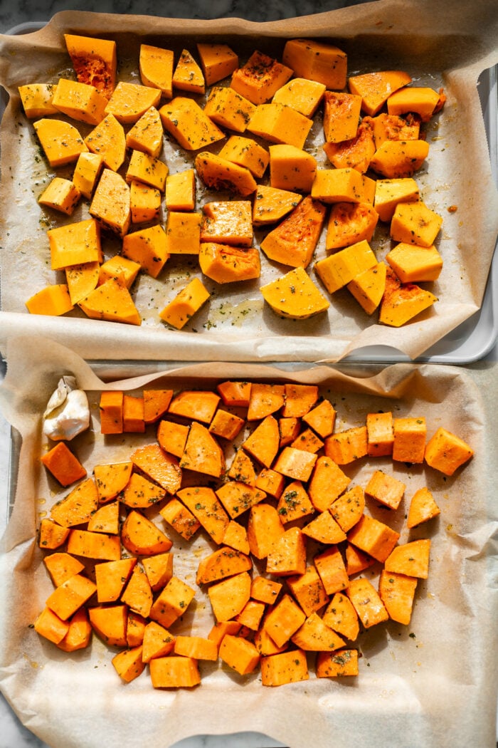 seasoned butternut squash and sweet potato on baking sheet