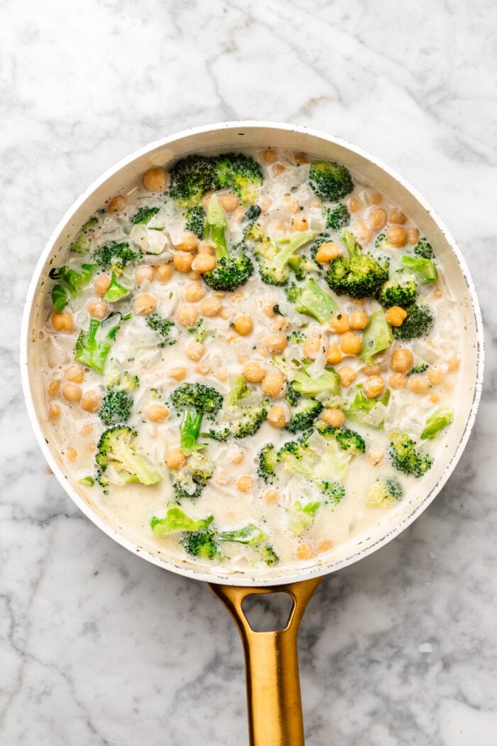 stirring in the dairy free milk and veggie broth