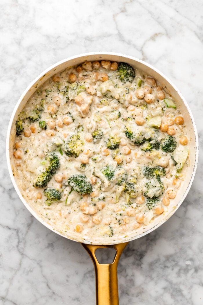 finishing the chickpea broccoli alfredo skillet