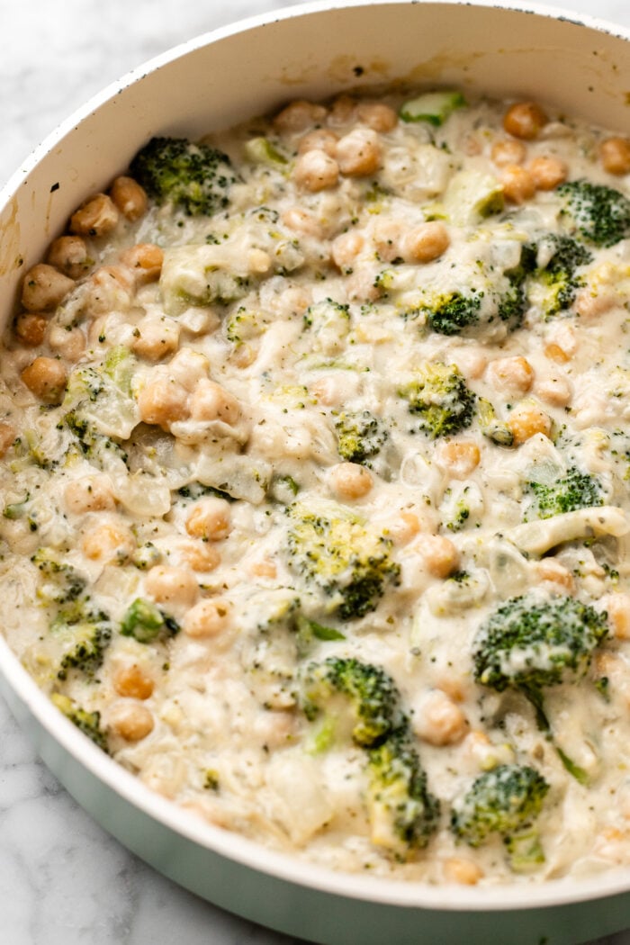 serving the chickpea broccoli alfredo skillet