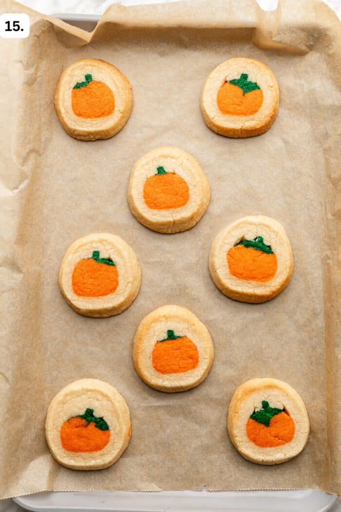 baked pillsbury cookies on a baking sheet with parchment paper.
