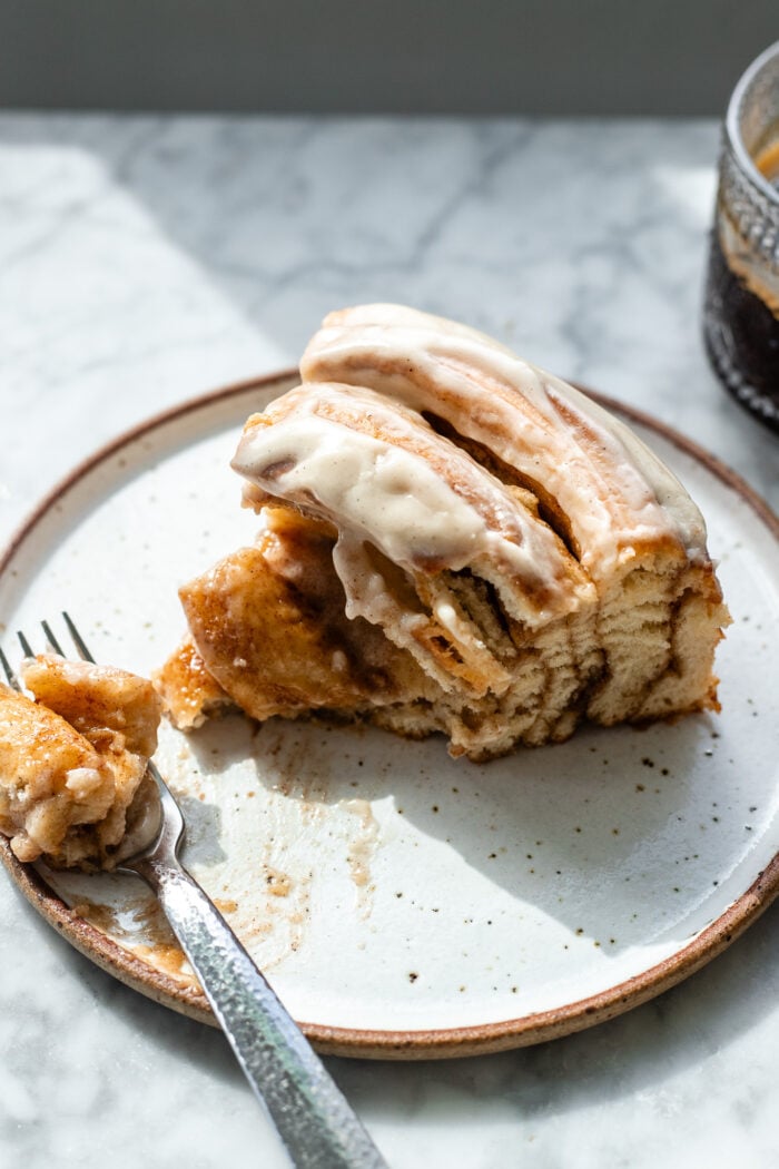 gooey slice of cinnamon roll cake