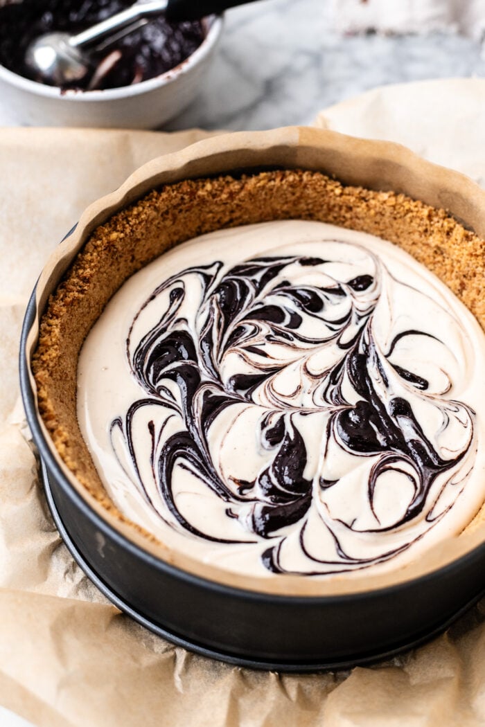 assembling the no bake choco taco cheesecake