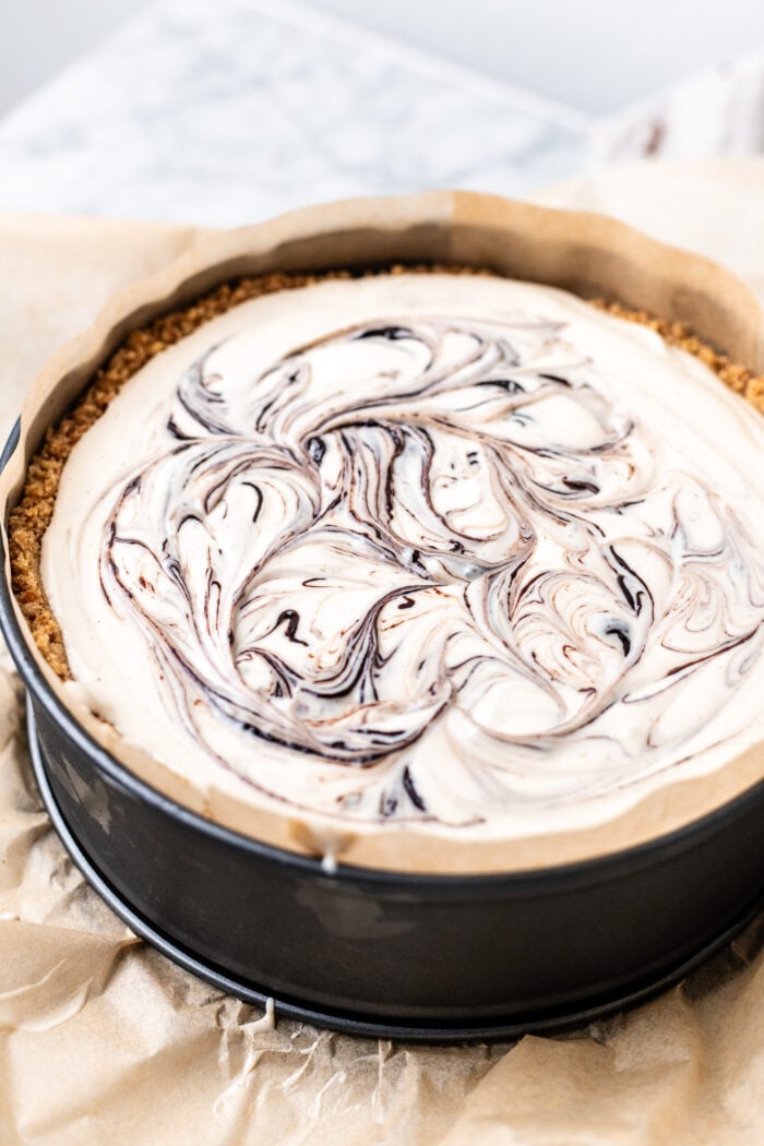 assembling the no bake choco taco cheesecake