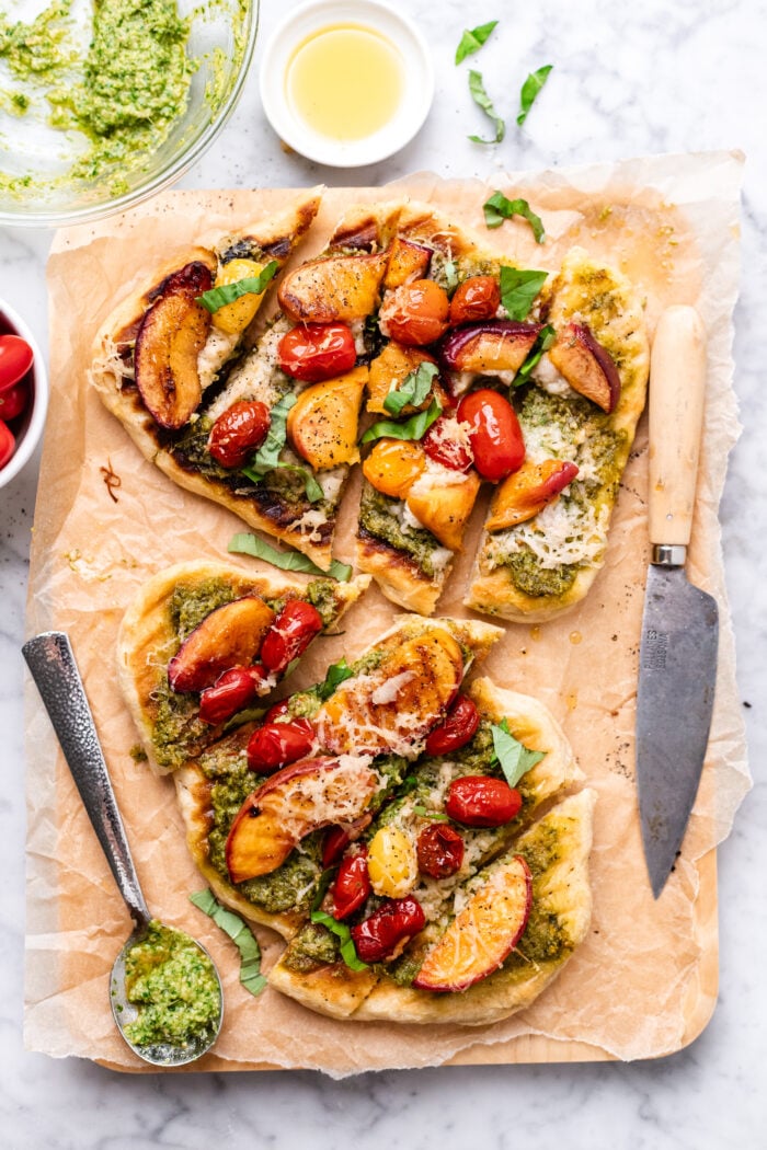 grilled flatbread pizzas on parchment paper