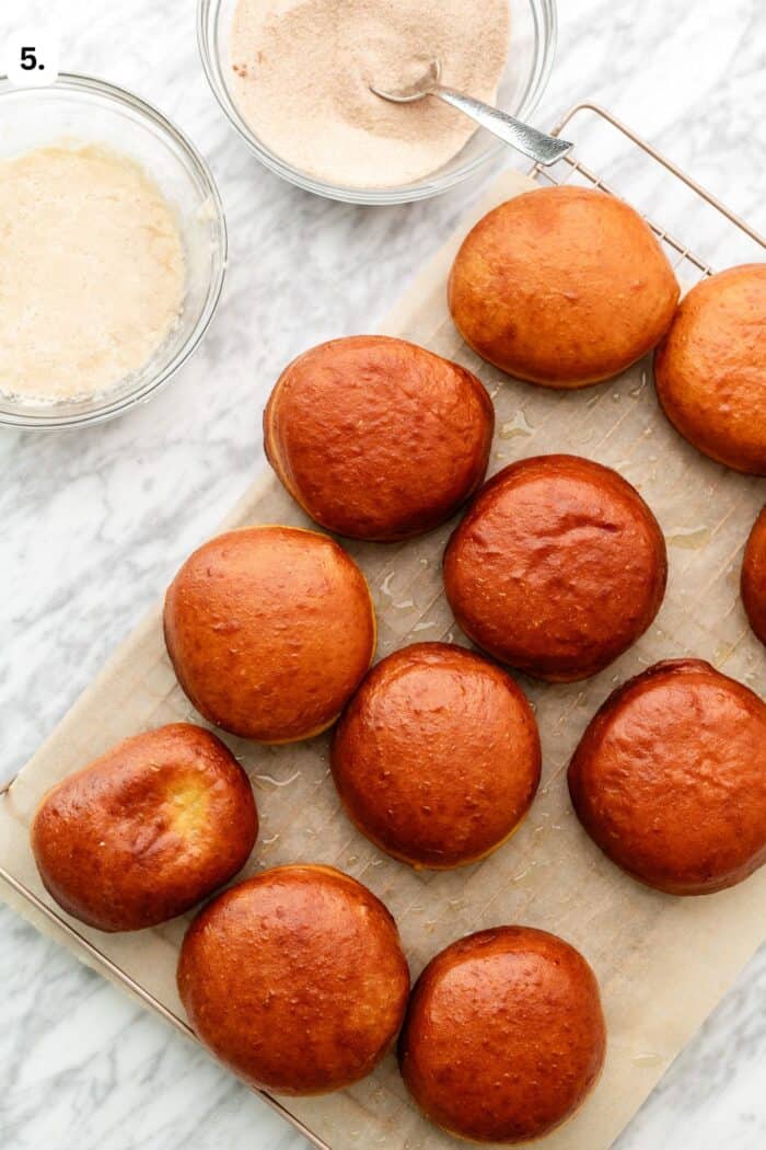 fried doughnuts with cinnamon sugar and melted vegan butter next to each other.