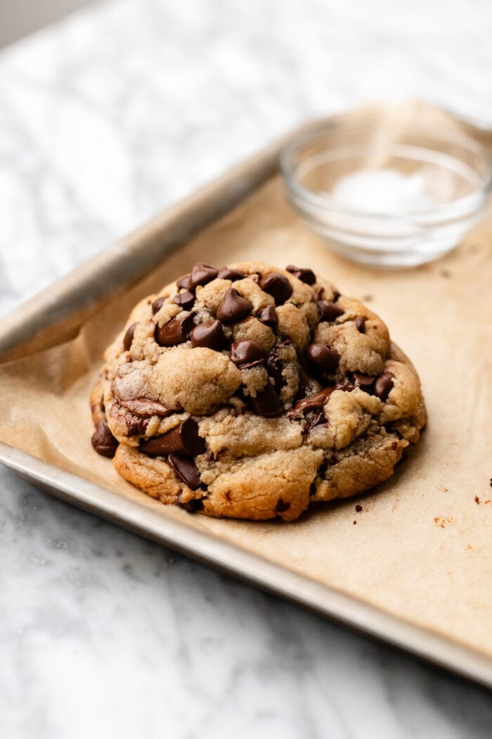 chocolate chip cookie on baking sheet