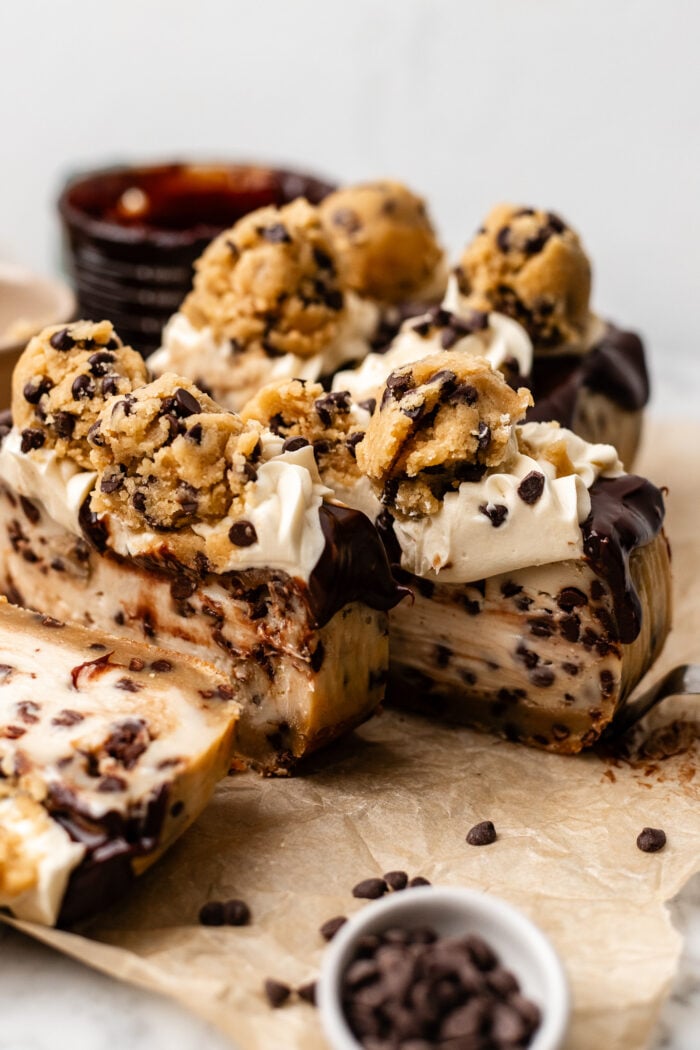 sliced small batch cookie dough cheesecake on parchment paper