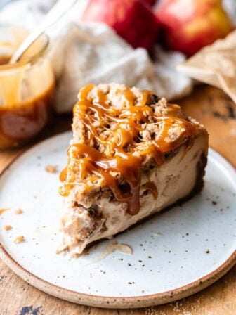 slice of vegan apple crumble cheesecake on a plate