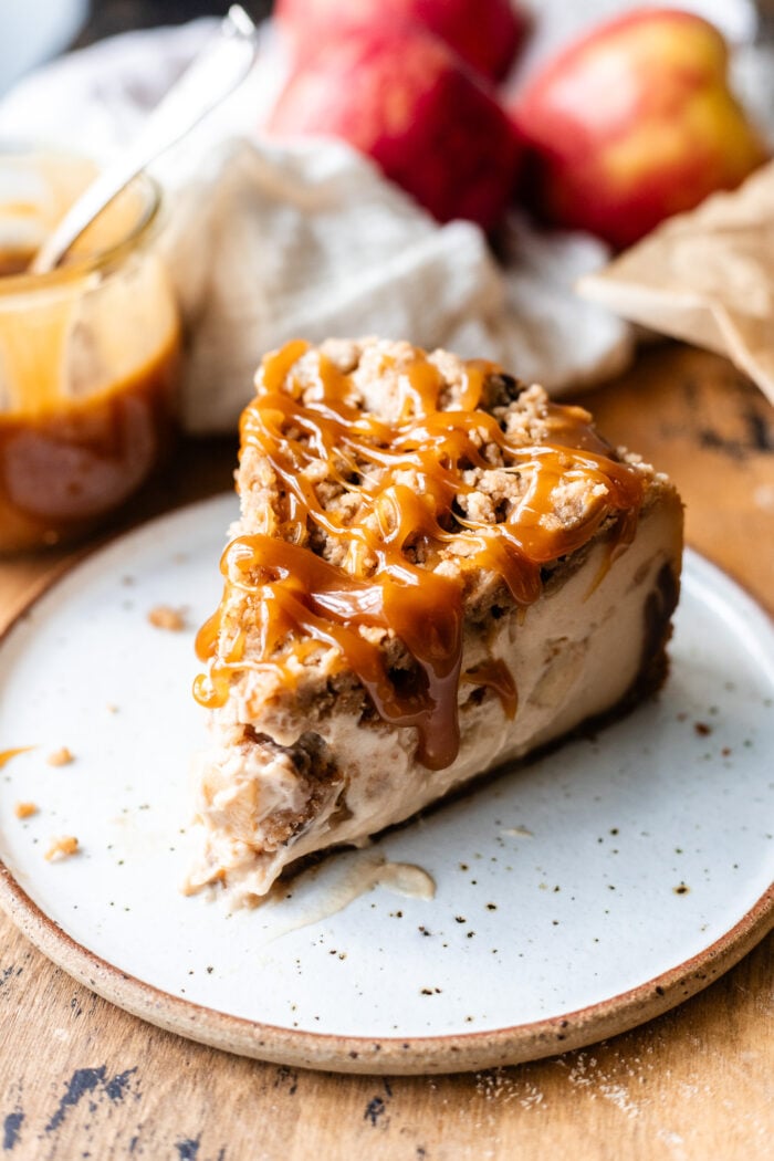 slice of vegan apple crumble cheesecake on a plate