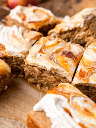 sliced apple caramel cake on parchment paper
