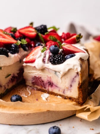 sliced vegan chantilly cheesecake on a board