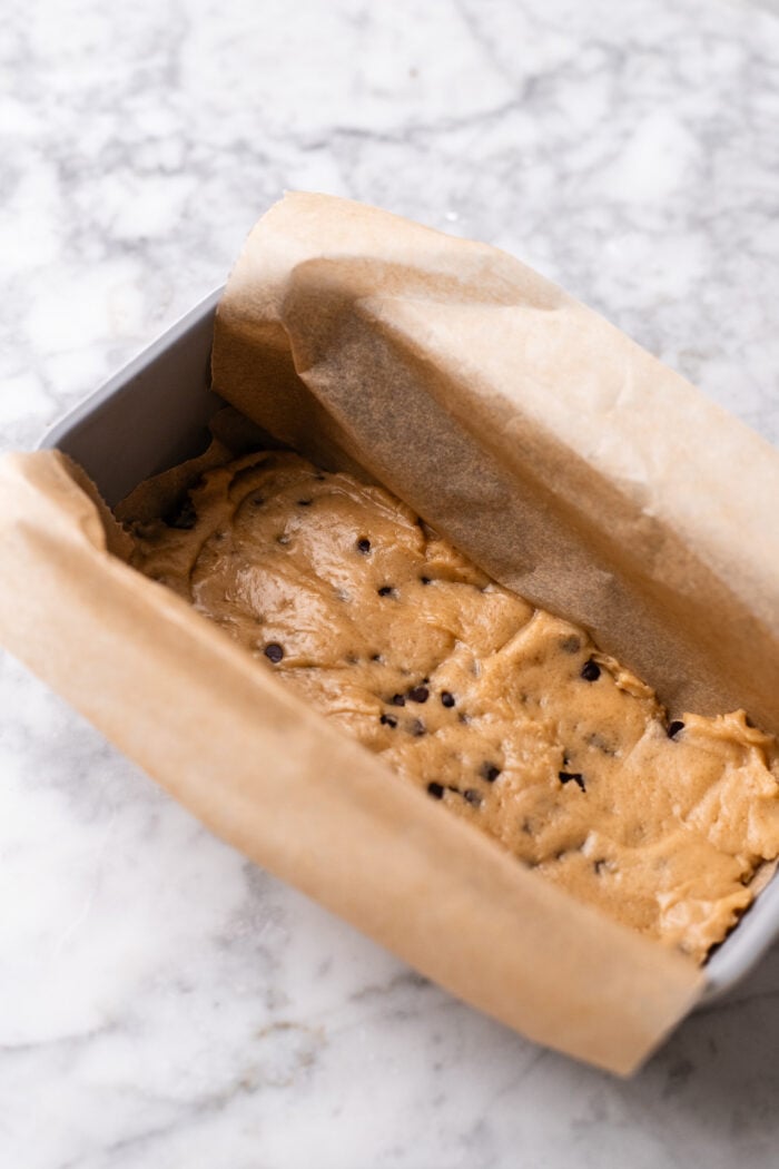 cookie dough assembling on top of brownie batter