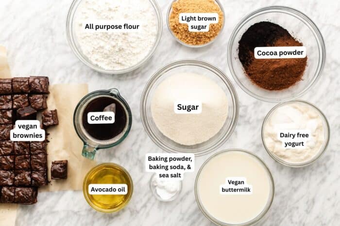 brownie cake ingredients layed out on a marble table.