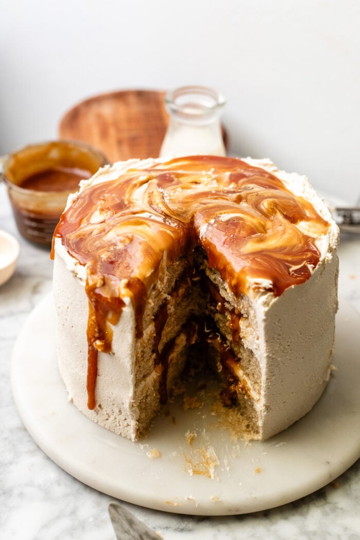 sliced vegan caramel cake on a marble plate