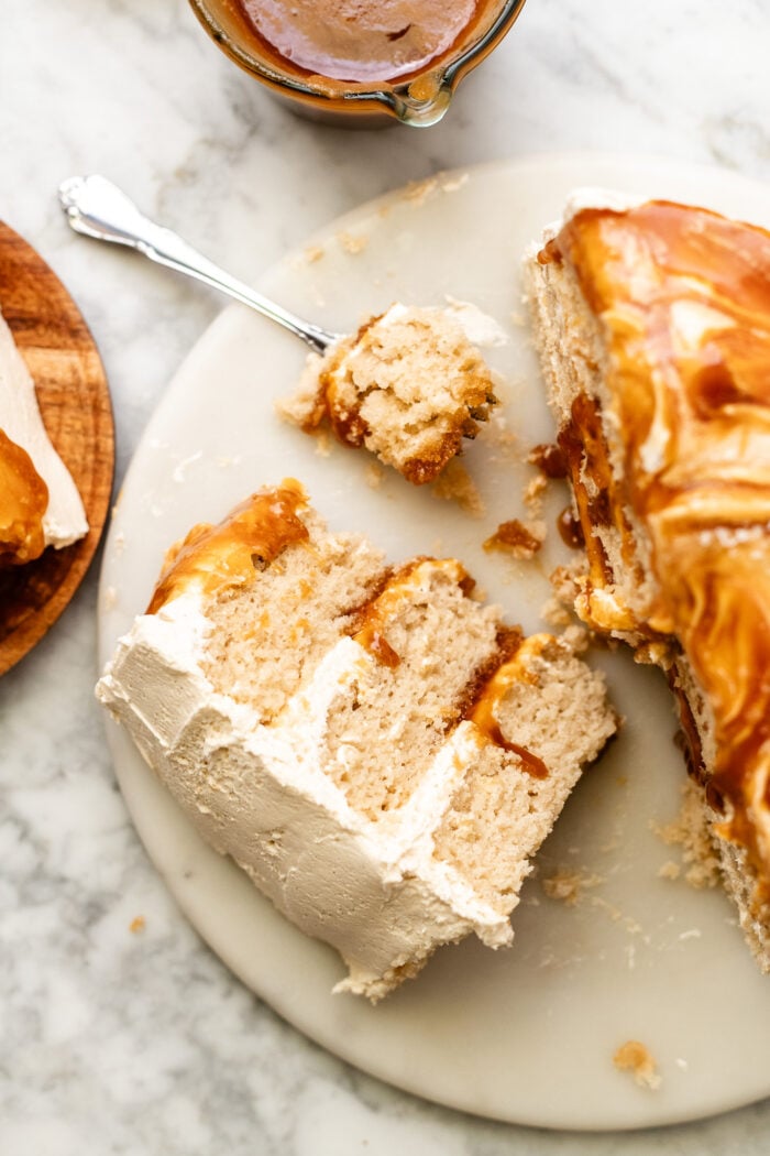 bitten slice of vegan caramel cake