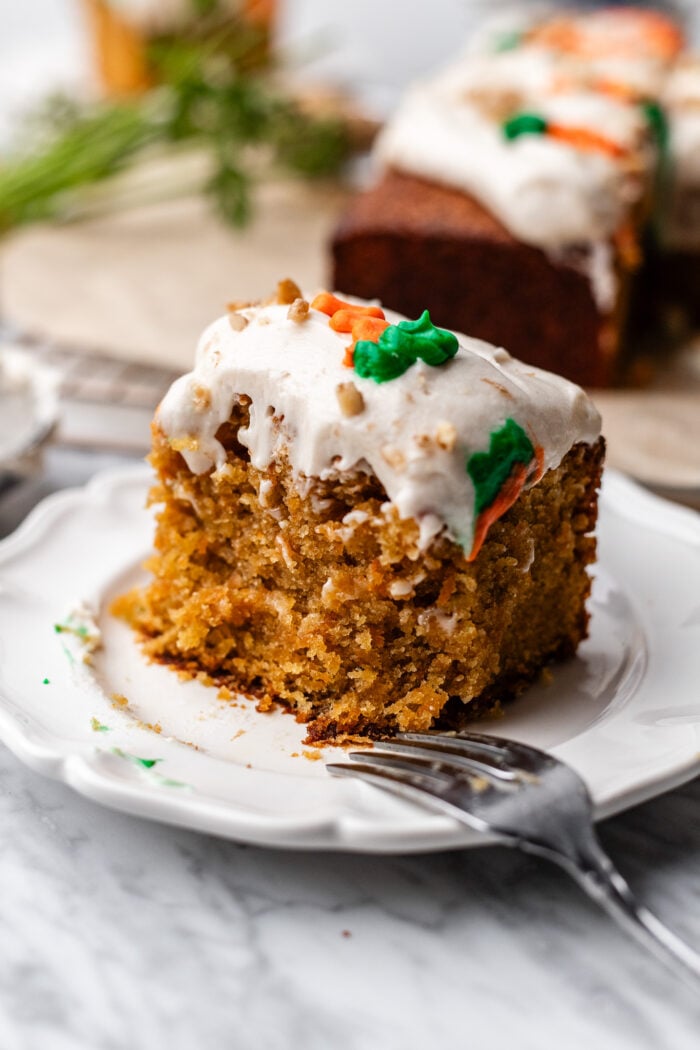 sliced carrot cake eaten on a plate