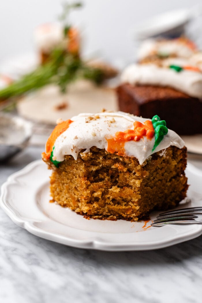 slices of bitten carrot cake on a plate