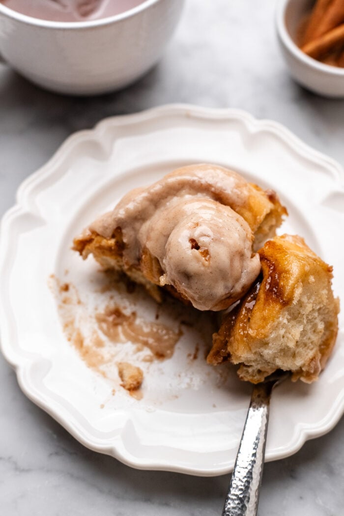sliced vegna chai cinnamon roll on a plate