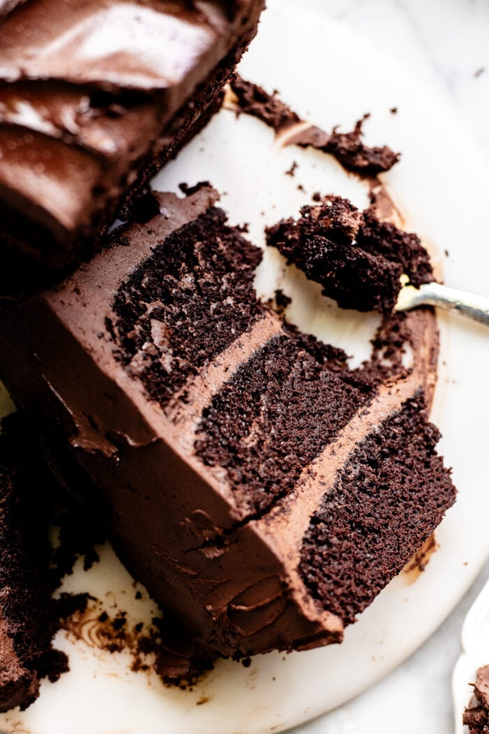 sliced vegan chocolate cake on a cake stand