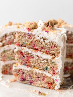 sliced vegan funfetti cake on marble plate
