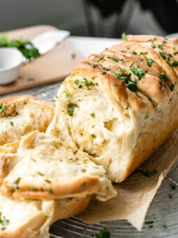 pulled apart garlic bread on cooling rack