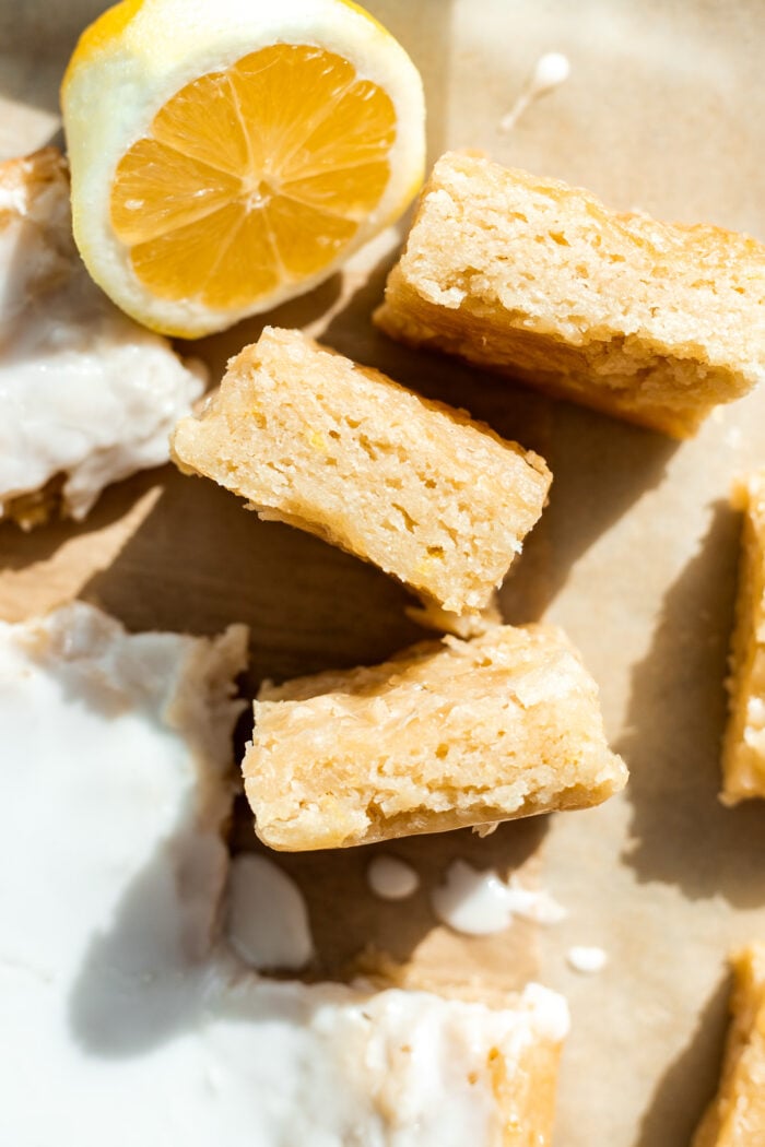 lemon brownies sliced on parchment paper