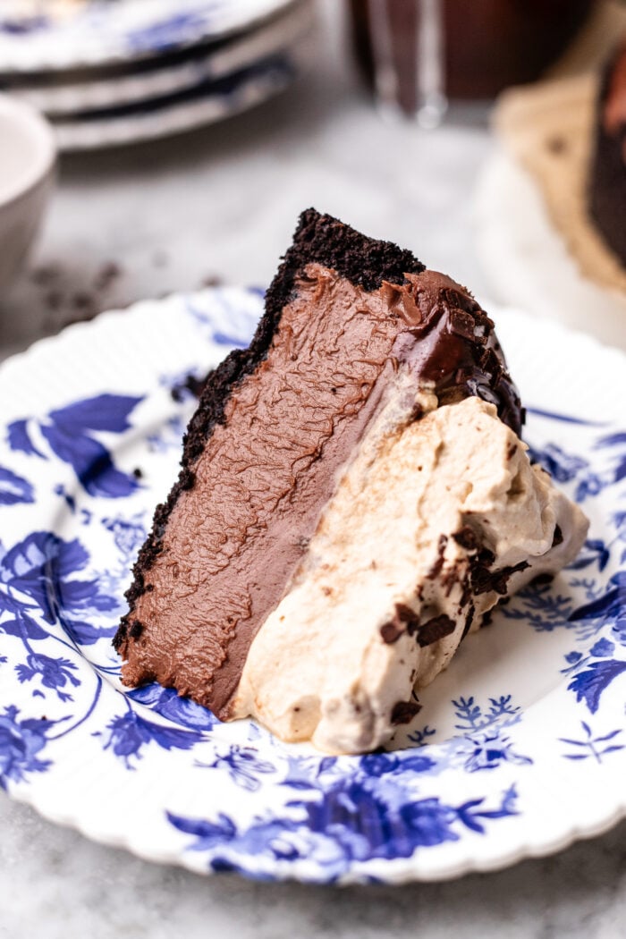 slice of vegan no bake chocolate cheesecake on a plate