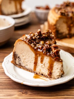 slice of pecan pie cheesecake on a plate