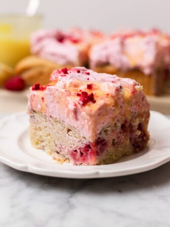 plate of raspberry lemon cake with raspberry frosting