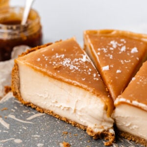 slices of vegan caramel cheesecake on plate
