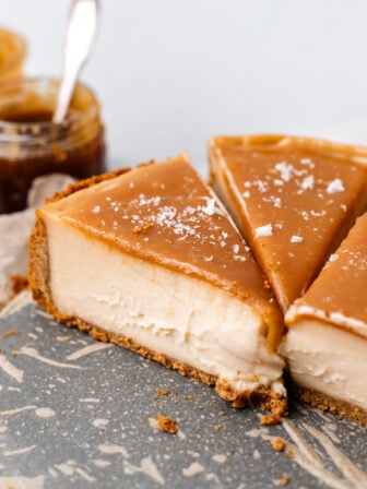 slices of vegan caramel cheesecake on plate