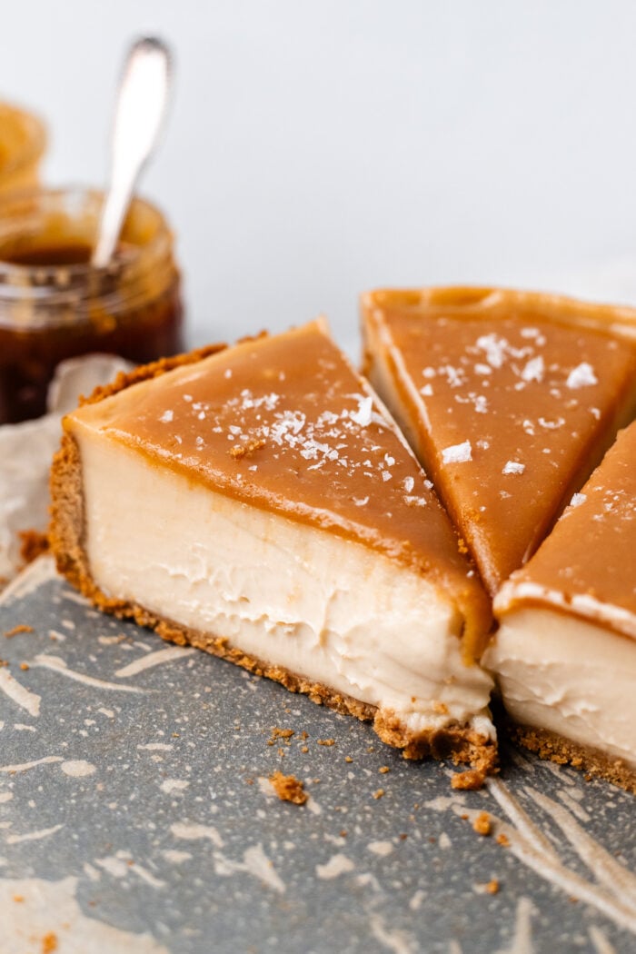 slices of vegan caramel cheesecake on plate