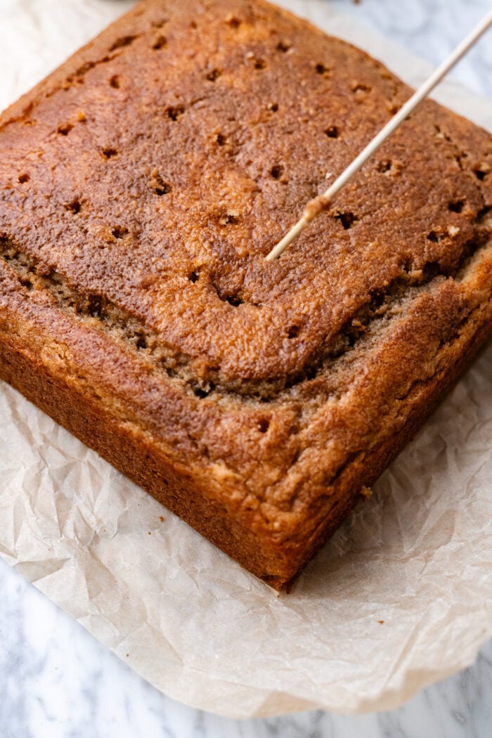 poking holes into the cake