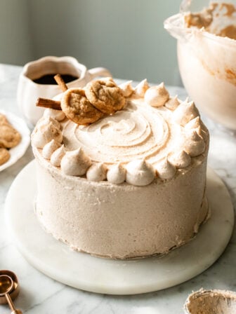 vegan snickerdoodle cake on a cake board