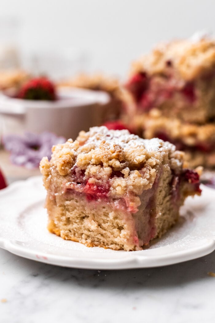 slice of vegan strawberry crumb cake on a plate