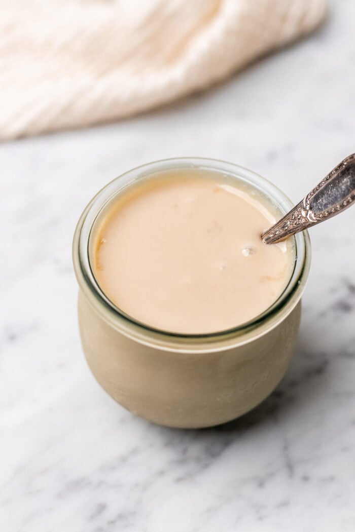 jar of cooled vegan sweetened condensed milk