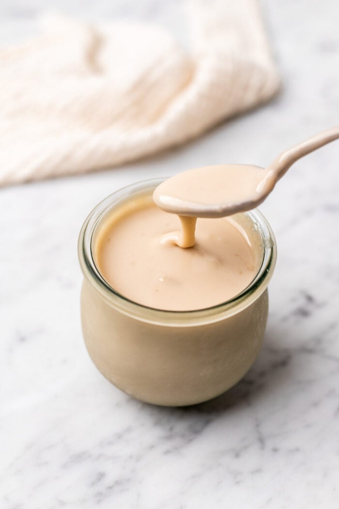 jar of vegan sweetened condensed milk 